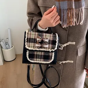Mini plaid children's backpack with vintage leather trim and lace bow detailing