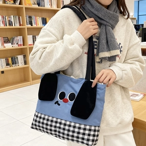 Cute cartoon kids tote bag with blue canvas, funny face and checkered bottom pattern