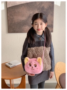 Detail of pink plush cartoon cat crossbody bag with soft faux fur and embroidered features
