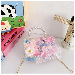 Detailed view of plush Elsa rainbow handbag with pearl handle and golden sequins