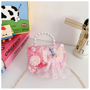 Detail of pink plush kids handbag featuring Elsa IP motif, pearl handle and gold chain