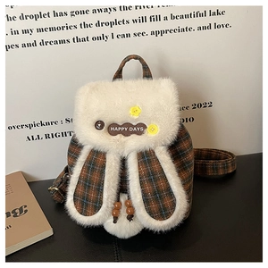 Close-up of cute checkered drawstring backpack with plush trim and HAPPY DAYS embroidery