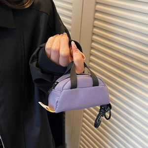 Purple tactical mini coin pouch with black handles and carabiner clip for outdoor gear