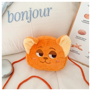 Detailed view of orange plush fox crossbody bag with embroidery and woven strap