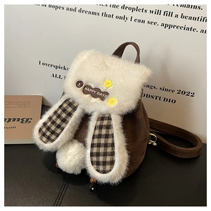 Detail of cute rabbit ears and fluffy texture on a brown plush backpack for girls
