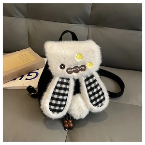 Detail showing the plush texture, checkered ears, and decorative patches on the cute bunny bag