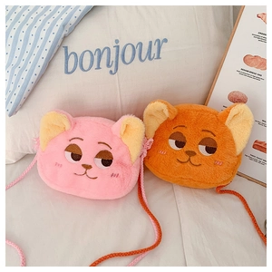 Detailed view of plush cat crossbody bags with embroidered faces and rope straps