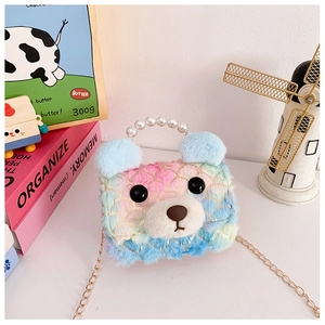 Detailed view of rainbow faux fur bear bag with pearl handle and golden chain strap