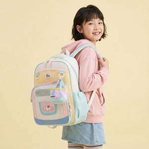 Sac à dos enfant coloré avec design patchwork, grande capacité et pendentif mignon