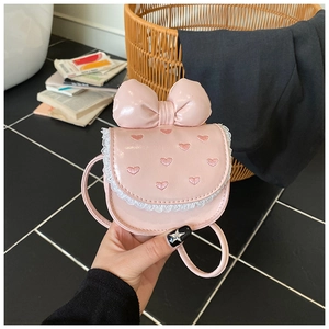 Detailed view of pink heart embroidery and white lace trim on the PU leather mini bag