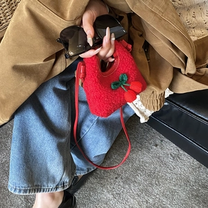 Cute cherry plush crossbody bag for kids with red fuzzy material and green leaf detail