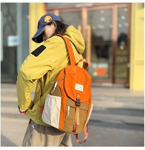Detail shot of the contrast color outdoor kids backpack with adjustable flap and side pockets