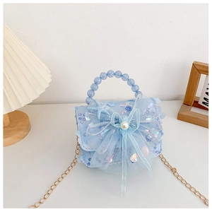 Détail du sac à main bleu clair pour filles avec paillettes, nœud et perles
