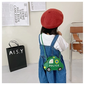 Rear view of a child wearing a green cartoon police car crossbody bag with leather strap