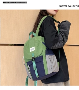 Close-up of kids color-block outdoor backpack with mountains embroidery and buckle