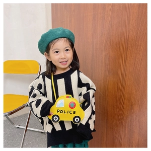 Detail shot of a yellow cartoon police car crossbody bag for kids with thin shoulder strap