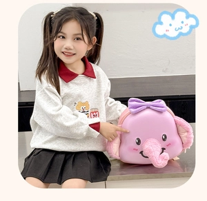 Detail of pink elephant 3D kids backpack with soft plush ears and purple bow decoration