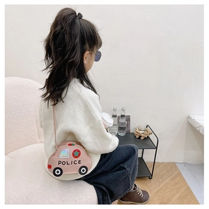 Detailed view of pink car-shaped police kids crossbody bag with star decorations