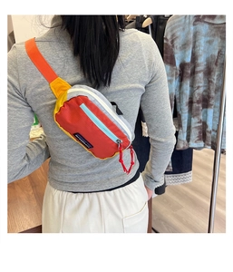 Rear view of colorful mini crossbody chest bag with adjustable orange strap for kids