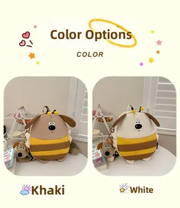 Detail view of khaki and white cartoon dog backpacks with plush charms in a cozy setting
