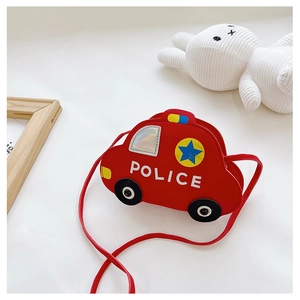 Detail of red cartoon police car cross-body bag for kids with durable leather texture
