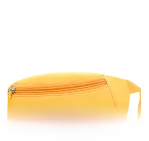 Detail of bright yellow kids belt bag showing fabric texture and sequined letter Y patch