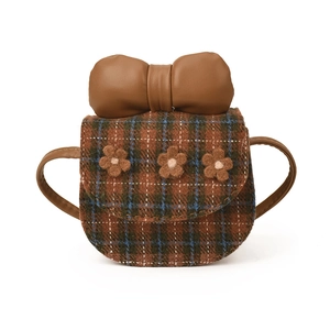 Mini brown plaid crossbody bag with large leather bow and flower accents on white base