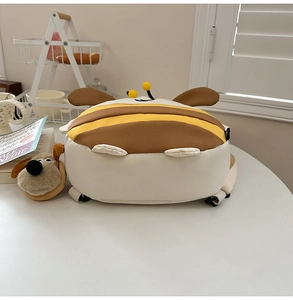 Detail of cute bee-shaped toddler backpack featuring striped flap and 3D antennae