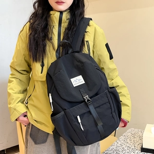 Black outdoor casual backpack with MOUNTAINS label and waterproof fabric for kids