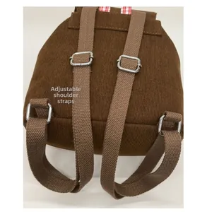Detail of adjustable coffee brown straps and corduroy texture on children backpack