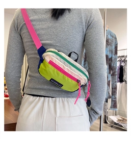 Kids streetwear crossbody bag with vibrant color-blocking nylon fabric shown on a model
