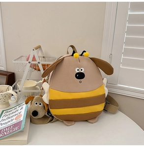 Detailed macro view of the cute cartoon bee puppy backpack with soft plush textures