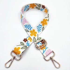 Adjustable wide shoulder strap with colorful floral patterns and gold metal clasps