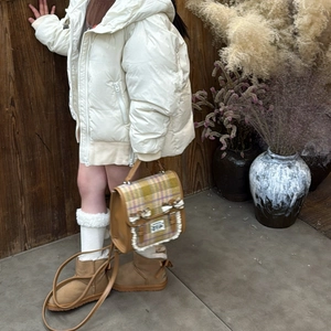 Kids plaid backpack with white lace bow and brown leather body for winter outfits