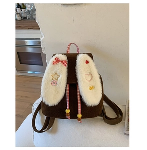 Detail showing plush rabbit ears and corduroy texture on children's backpack