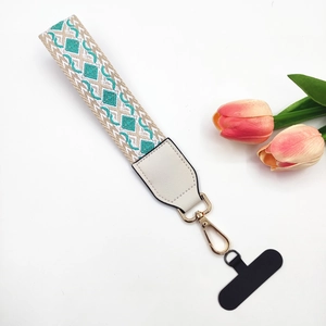 Bohemian style woven phone lanyard with geometric patterns and gold metal spring clip