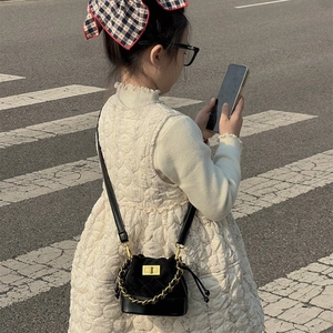 Fashionable kids black quilted bucket bag with gold chain and drawstring straps