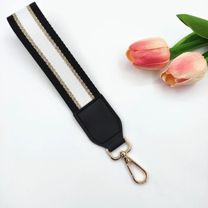 Multipurpose black and white striped wrist strap with gold metallic lobster clasp hooks