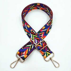 Detailed view of colorful geometric floral pattern on an adjustable polyester bag strap