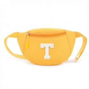 Detail showing bright yellow nylon waist bag with a large white fuzzy letter T patch