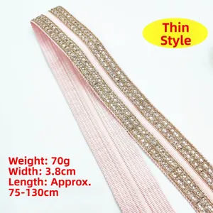Detailed view of pink embroidered strap with silver sequins and metallic gold stitching