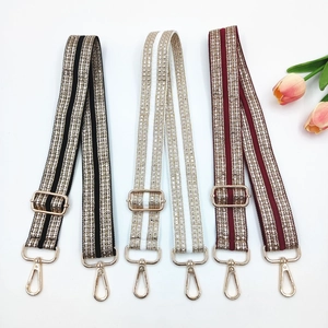 Adjustable wide shoulder straps with sparkling white rhinestones and gold metal hardware