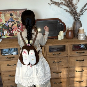 Plush bunny ear backpack for kids in brown faux suede with cute decorative patches