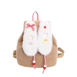 Brown corduroy toddler backpack with plush rabbit ears and checkered bow detail