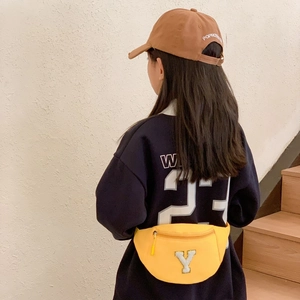 Kids trendy yellow waist bag with large white letter patch in casual sports style