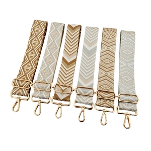 Adjustable jacquard bag straps with geometric patterns and gold metal swivel hooks