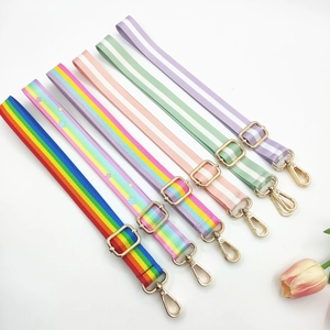 Detail of adjustable rainbow shoulder straps with gold metal hooks for handbags