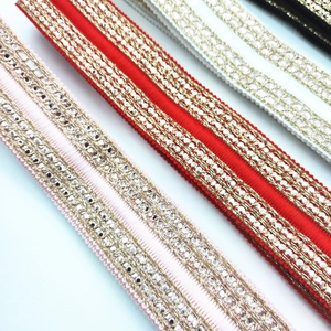 Detail of 3.8cm ethnic embroidered bag straps with metallic chain and sequins
