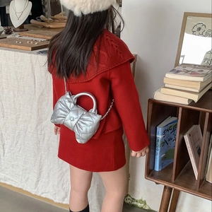 Silver quilted bow-shaped shoulder bag with metal chain strap for kids and girls