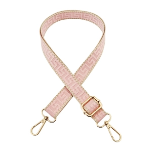Pink and beige geometric woven crossbody bag strap with gold metal lobster clasps